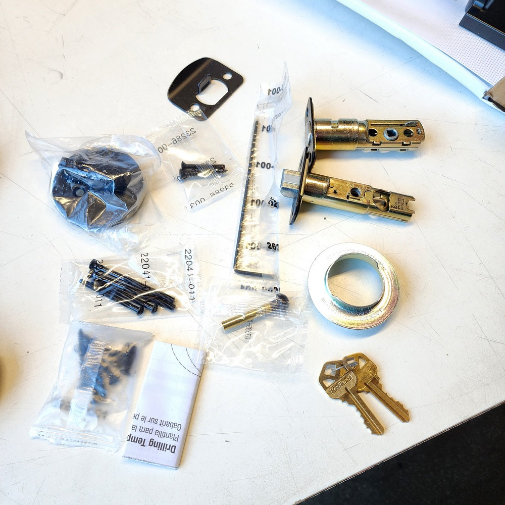 Amador Matte Black Entry Door Handleset with Round Rose Hollis Lever Featuring SmartKey Security (96870-165) Amador Matte Black Entry Door Handleset with Round Rose Hollis Lever Featuring SmartKey Security (96870-165)